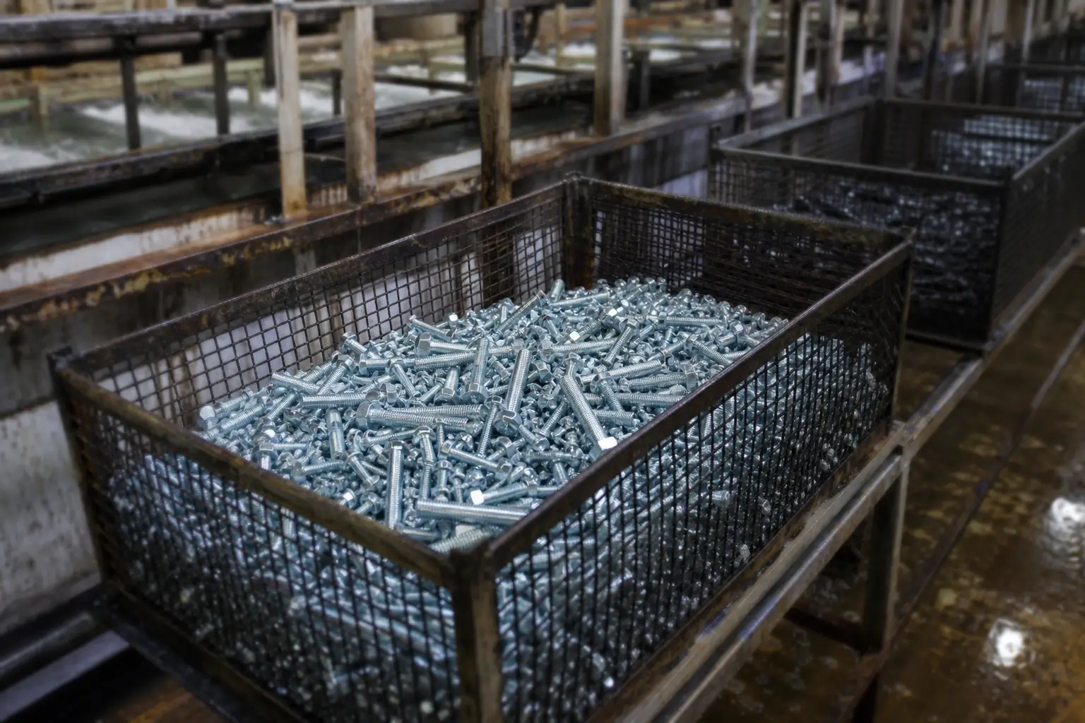 Zinc plated bolts in a treatment basket